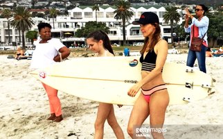KIMBERLEIGH GELBER SURFING IN CAMPS BAY, CAPE TOWN, SOUTH AFRICA